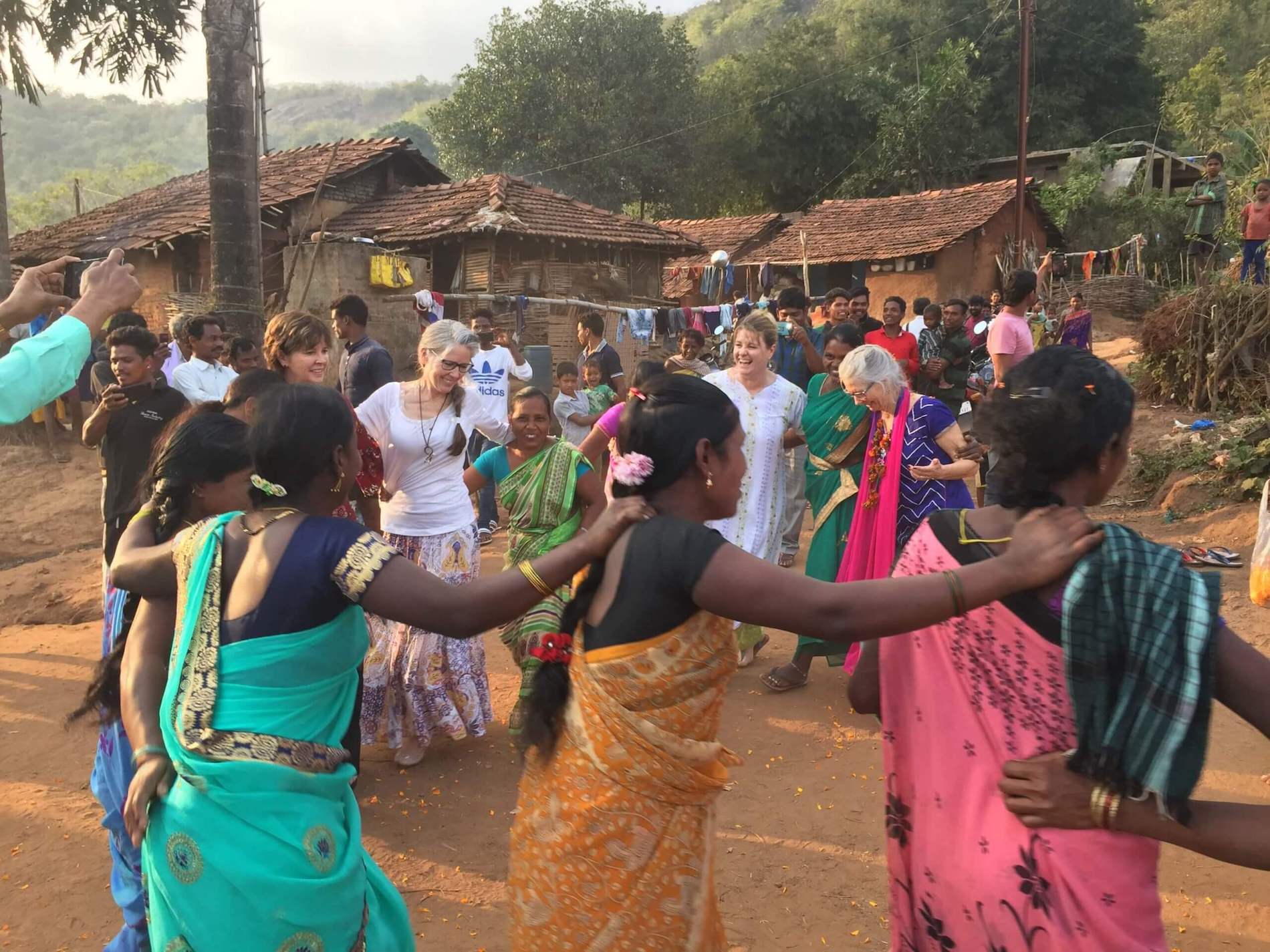 People dancing at a dedication event in India.