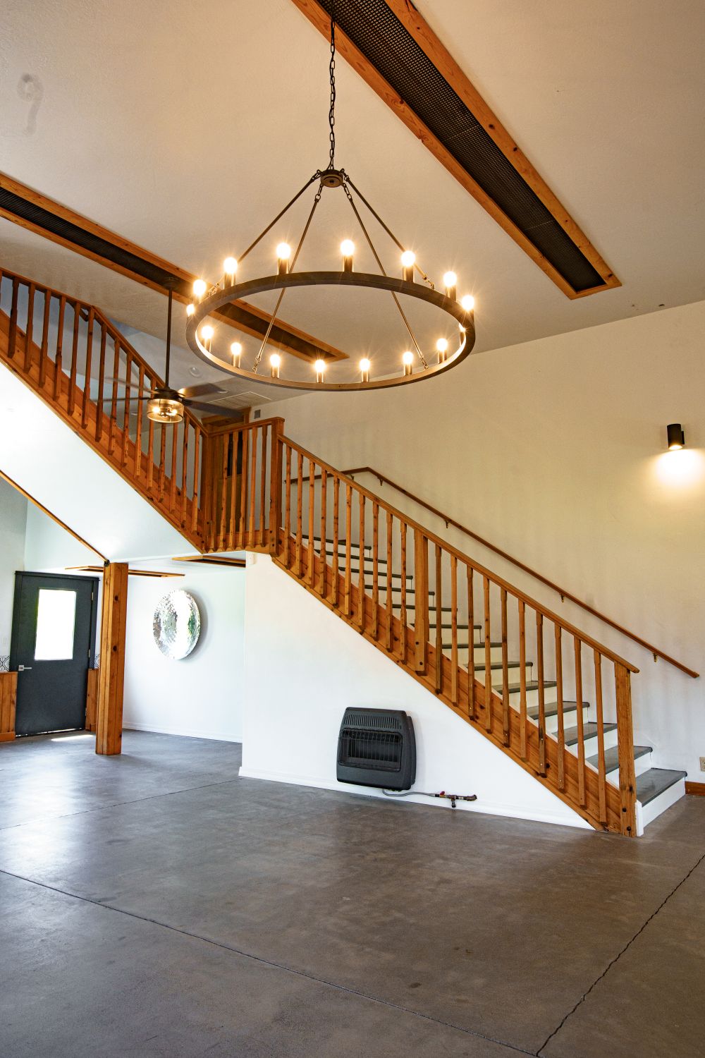 Chandelier and staircase inside of the Apple Barn event venue.